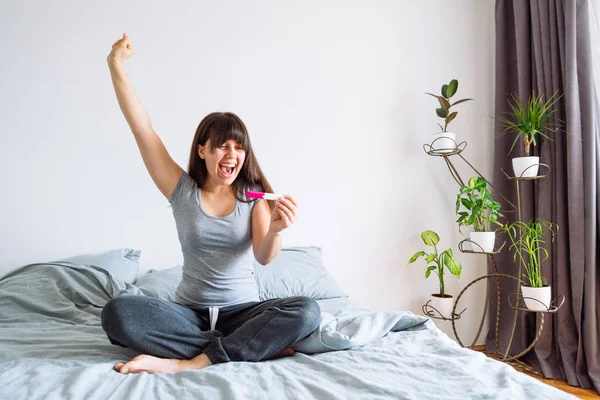 Young Happy Woman Sitting Bed Looking Positive Pregnancy Test — Stock Photo, Image