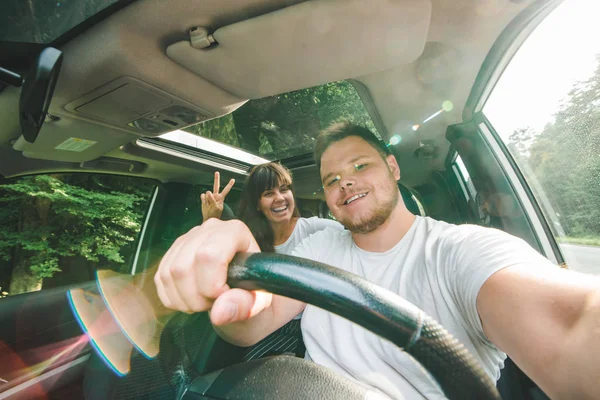 couple in car. long road trip. car travel concept