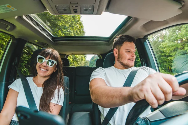 couple in car. long road trip. car travel concept