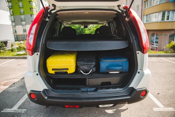 car trunk with loaded bags. car travel concept. road trip