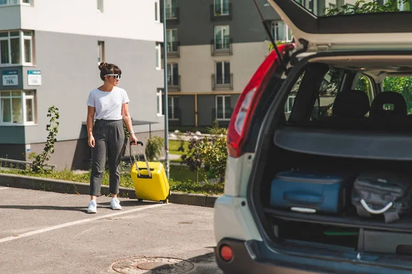 Woman Pull Suitcase Wheels Car Trunk Road Trip Car Travel — Stock Photo, Image