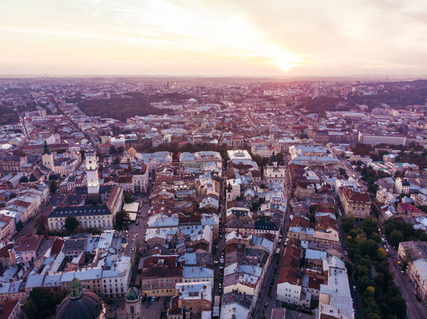 Aerial view of sunset above european city. old gothic architecture