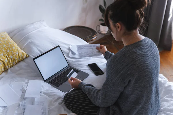 Young Adult Woman Looking Bills Holding Card Front Laptop White — Stock Photo, Image