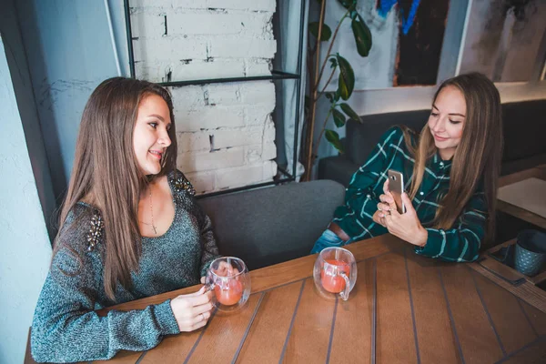 Women Sitting Cafe Girlfriends Taking Picture Phone While Drinking Warm — Stock Photo, Image