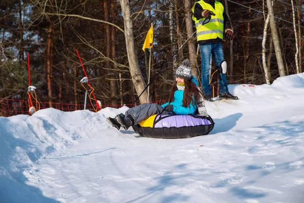 Young Smiling Girl Ride Sleigh Snow Tubing Hill Winter Activity — Stock Photo, Image