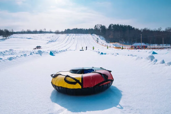 snow tubing. sleigh on the top of the hill. winter activity concept