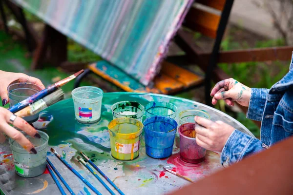 outdoors kinder garden children draw with paints