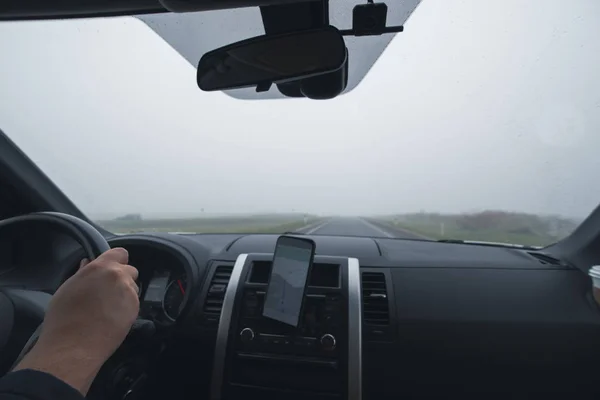 Car travel concept driving by wet speedway view from inside — Stock Photo, Image