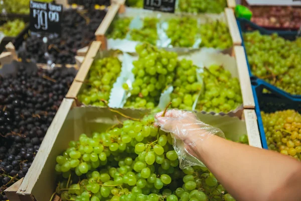 First person point of view man choosing grapes — Stock Photo, Image