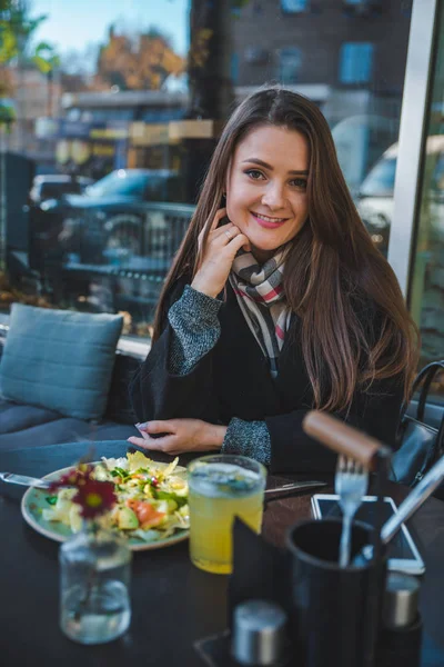 Woman in cafe eating salad hands close up no face — Stock Photo, Image