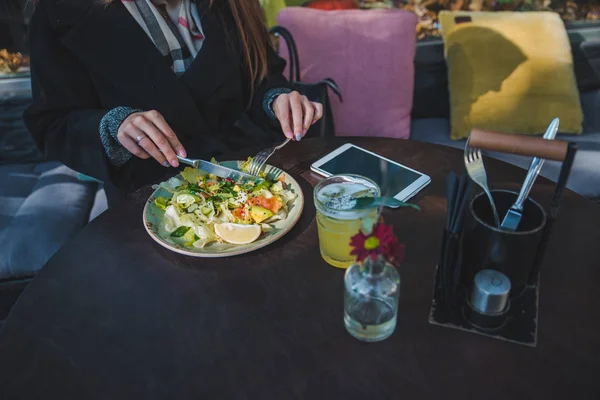 Woman in cafe eating salad hands close up no face — Stock Photo, Image