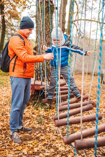 Father with toddler kid son playing at playground autumn season — Stock Photo, Image