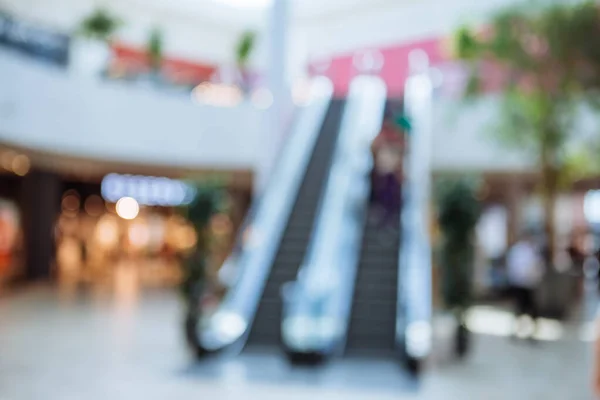 Blurred picture out of focus shopping mall with escalator — Stock Photo, Image
