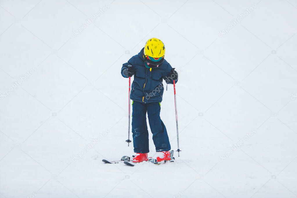 little kid learning to ski