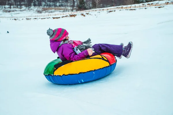 LVIV, UKRAINE - January 7, 2019: winter fun activities. ride down by hill on snow tubing — Stock Photo, Image