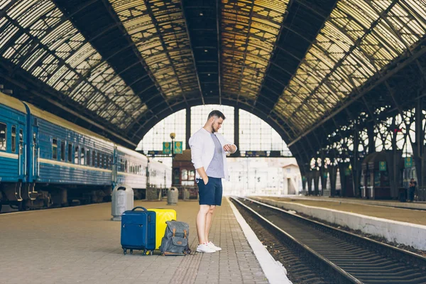 Man Railway Station Waiting Late Train Bag Looking Watch Wrist — Stock Photo, Image