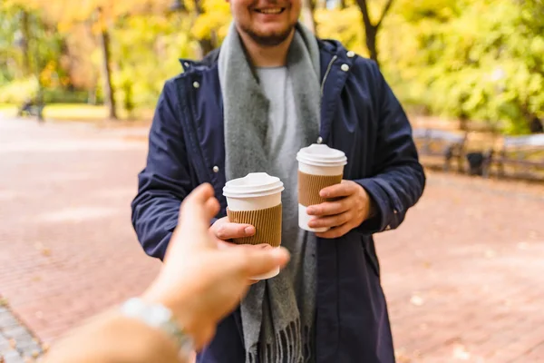 Man Brings Coffee Friend Drink Outdoors Autumn City Park Lifestyle — Stock Photo, Image