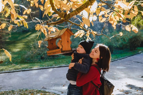 Young Mother Little Kid Put Seeds Bird Feeder Autumn Season — Stock Photo, Image