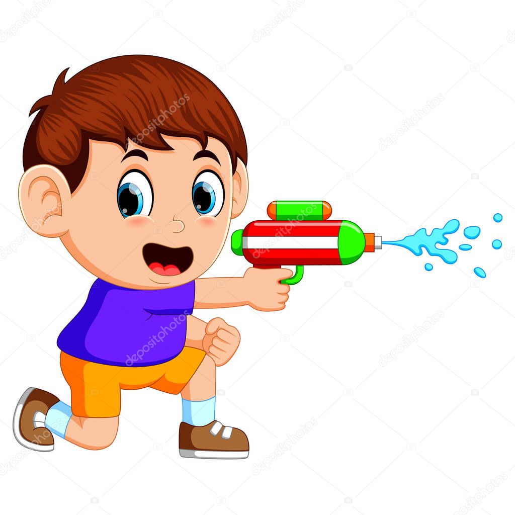 Boy playing with water gun