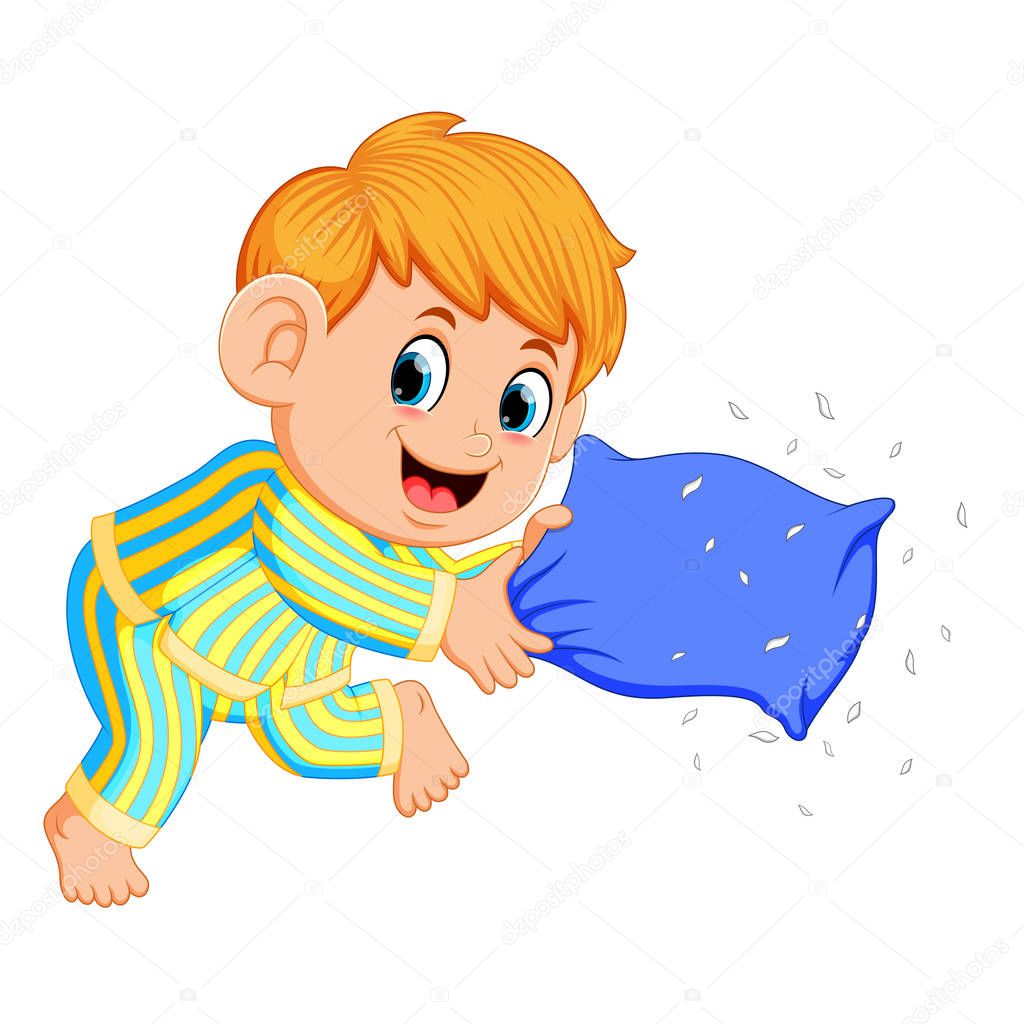 a boy playing pillow