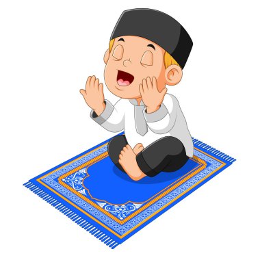  çocuk dua ediyor ve mavi dua halıüzerinde oturuyor