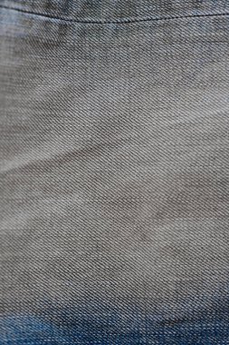 Jean moda kumaş yakın çekim. Denim arka plan. Eski grunge vintage doku Tekstil. Mavi renk
