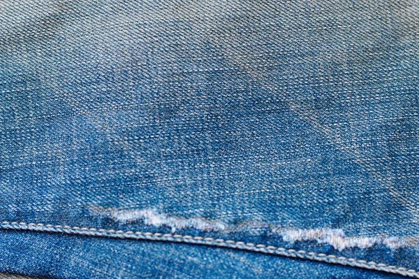 ジャン ファッション生地クローズ アップ デニムの背景 古いグランジ ビンテージ テクスチャ繊維 青い色 — ストック写真
