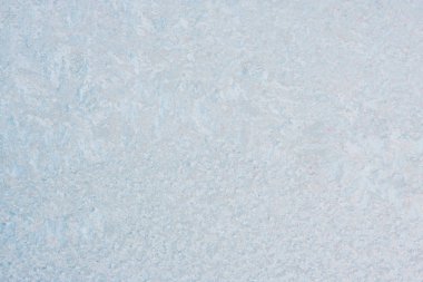 Winter background with gleaming ice. Frozen water texture. Copy space