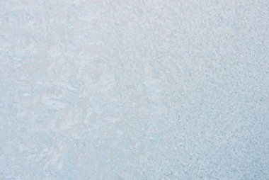 Winter background with gleaming ice. Frozen water texture. Copy space