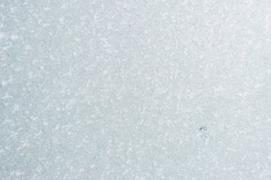 Winter background with gleaming ice. Frozen water texture. Copy space