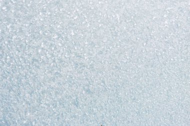 Winter background with gleaming ice. Frozen water texture. Copy space