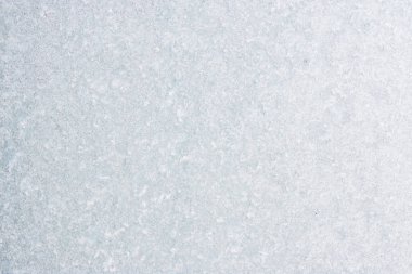 Winter background with gleaming ice. Frozen water texture. Copy space