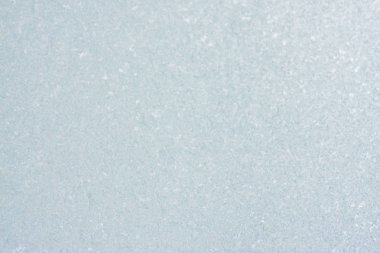 Ice background, frozen water with glass. Winter texture. Copy space