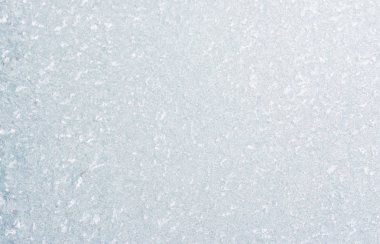 Ice background, frozen water with glass. Winter texture. Copy space