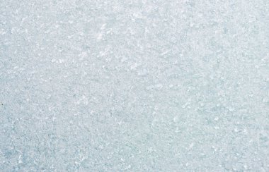 Ice background, frozen water with glass. Winter texture. Copy space