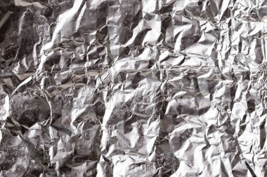Buruşuk folyo parlak metal doku arka plan duvar kağıdı dekorasyon öğesi için kağıt ambalaj gümüş. Platin gri metalik
