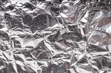 Buruşuk folyo parlak metal doku arka plan duvar kağıdı dekorasyon öğesi için kağıt ambalaj gümüş. Platin gri metalik