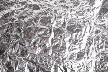 Buruşuk folyo parlak metal doku arka plan duvar kağıdı dekorasyon öğesi için kağıt ambalaj gümüş. Platin gri metalik