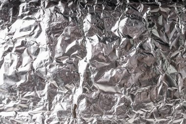 Buruşuk folyo parlak metal doku arka plan duvar kağıdı dekorasyon öğesi için kağıt ambalaj gümüş. Platin gri metalik