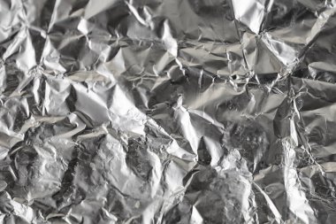 Buruşuk folyo parlak metal doku arka plan duvar kağıdı dekorasyon öğesi için kağıt ambalaj gümüş. Platin gri metalik