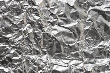 Buruşuk folyo parlak metal doku arka plan duvar kağıdı dekorasyon öğesi için kağıt ambalaj gümüş. Platin gri metalik