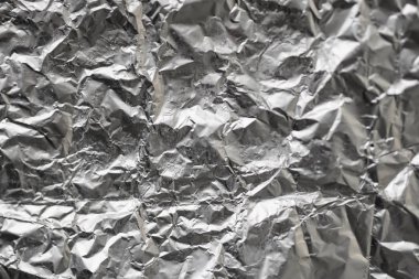 Buruşuk folyo parlak metal doku arka plan duvar kağıdı dekorasyon öğesi için kağıt ambalaj gümüş. Platin gri metalik