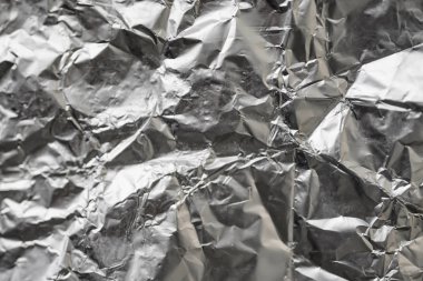 Buruşuk folyo parlak metal doku arka plan duvar kağıdı dekorasyon öğesi için kağıt ambalaj gümüş. Platin gri metalik