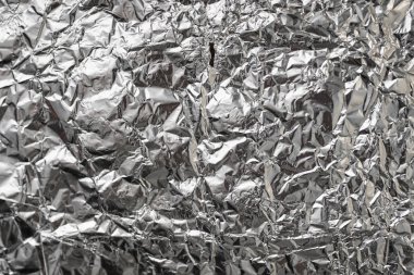 Buruşuk folyo parlak metal doku arka plan duvar kağıdı dekorasyon öğesi için kağıt ambalaj gümüş. Platin gri metalik