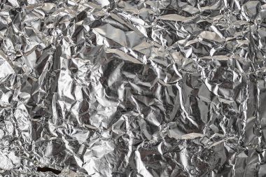 Buruşuk folyo parlak metal doku arka plan duvar kağıdı dekorasyon öğesi için kağıt ambalaj gümüş. Platin gri metalik