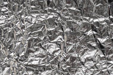 Buruşuk folyo parlak metal doku arka plan duvar kağıdı dekorasyon öğesi için kağıt ambalaj gümüş. Platin gri metalik