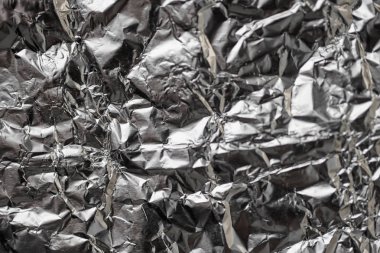 Buruşuk folyo parlak metal doku arka plan duvar kağıdı dekorasyon öğesi için kağıt ambalaj gümüş. Platin gri metalik