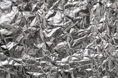 Buruşuk folyo parlak metal doku arka plan duvar kağıdı dekorasyon öğesi için kağıt ambalaj gümüş. Platin gri metalik