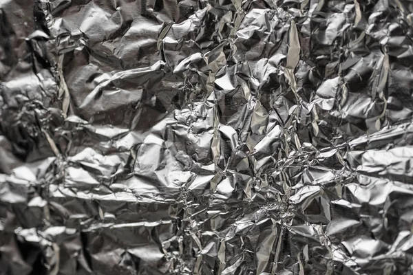 Buruşuk folyo parlak metal doku arka plan duvar kağıdı dekorasyon öğesi için kağıt ambalaj gümüş. Platin gri metalik