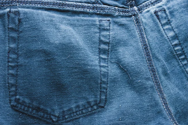 经典蓝色牛仔裤背景 牛仔纹理面料与时尚的设计接缝 空模式复制空间 选择性对焦 — 图库照片